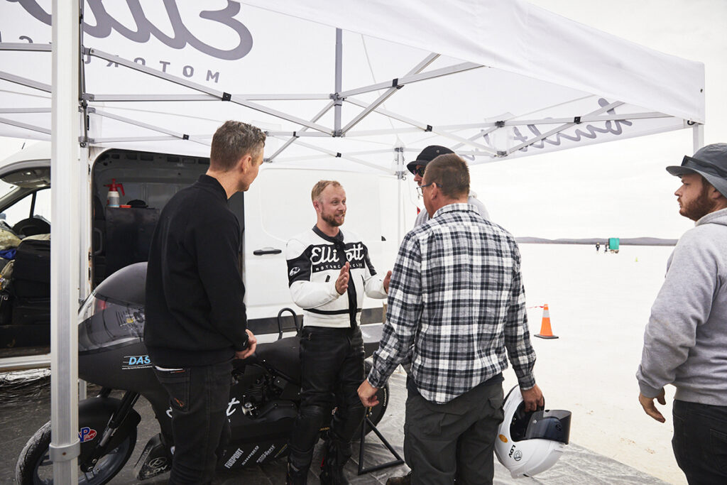 Elliott Motorcycles land speed racing team discussing the conditions in the pit area during Speed Week 2021 at Lake Gairdner in South Australia